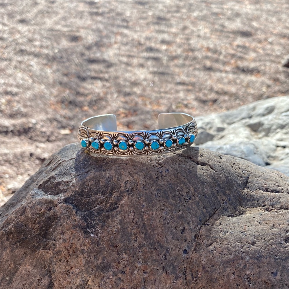 Sterling Silver and Turquoise Studded Cuff
Stamped Sterling and by the artist